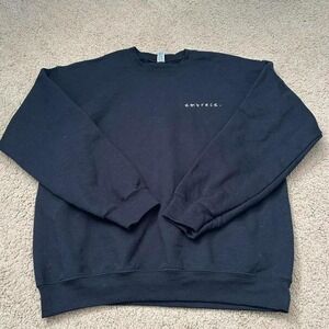 Black crewneck sweatshirt with "embrace" embroidered on the front